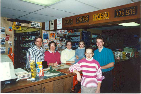 Glen & family behind counter 2